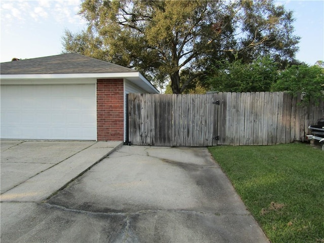 garage with a yard