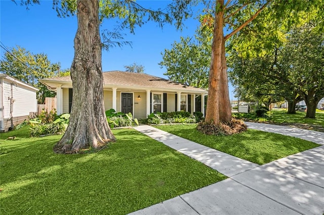 ranch-style house with a front lawn