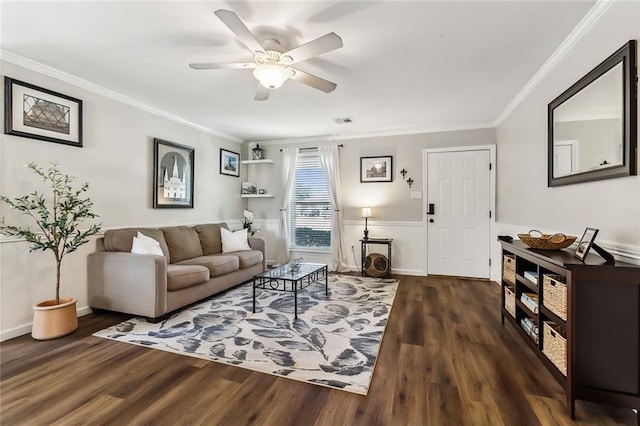 living room with ceiling fan, ornamental molding, and dark hardwood / wood-style flooring