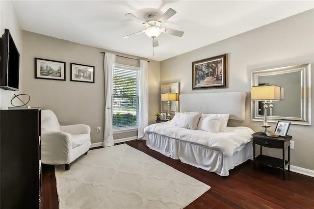 bedroom featuring ceiling fan and dark hardwood / wood-style flooring