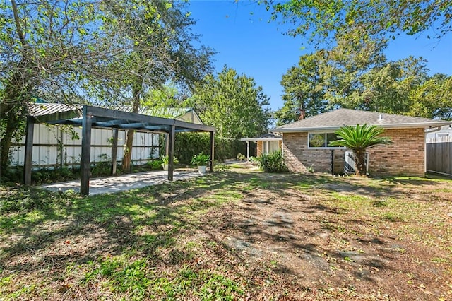 view of yard featuring a pergola and a patio area