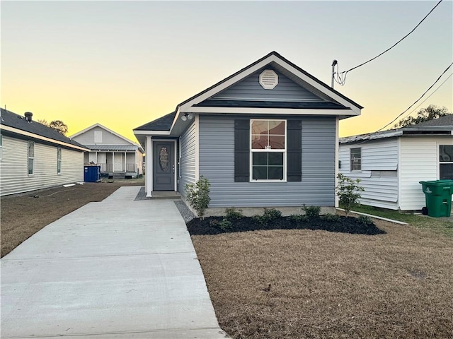 bungalow-style house with central air condition unit