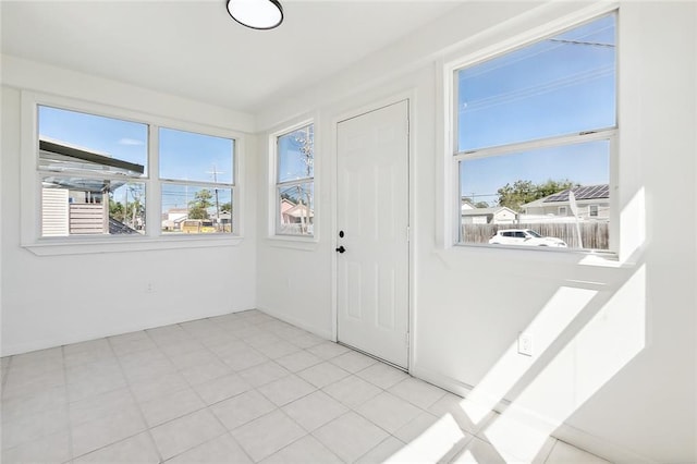 interior space with light tile patterned floors