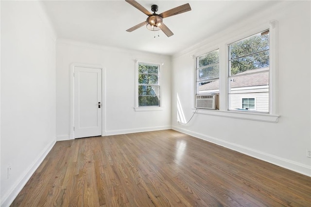 spare room featuring hardwood / wood-style floors and ceiling fan