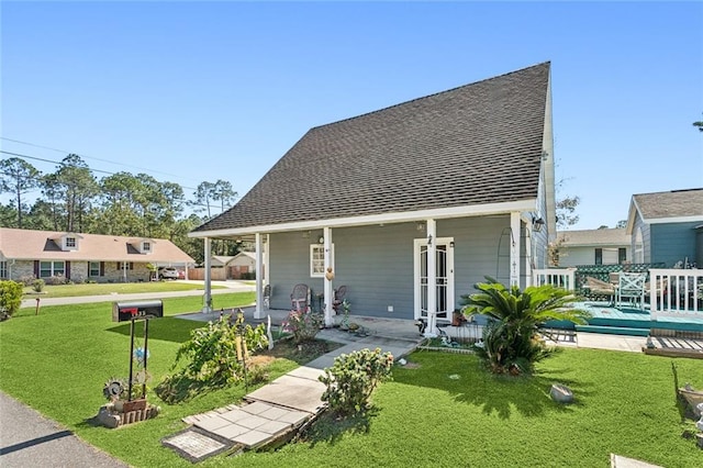 rear view of house with a yard