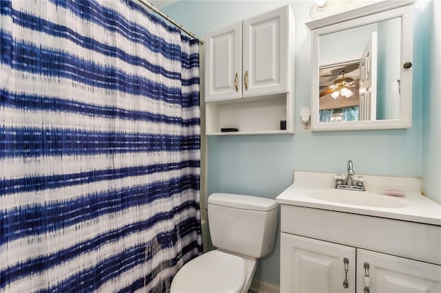 bathroom with vanity, toilet, and ceiling fan