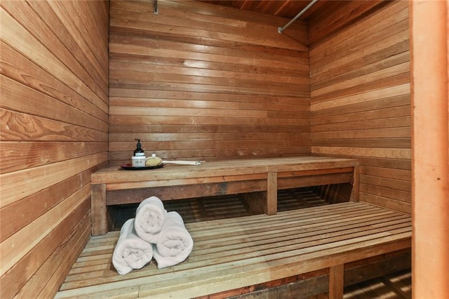 view of sauna / steam room with wooden walls