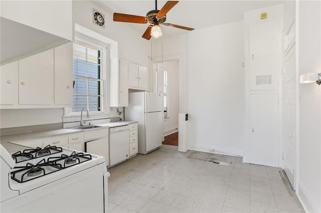 kitchen featuring white cabinetry, ceiling fan, sink, and white appliances