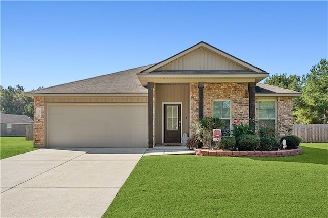 single story home with a front yard and a garage