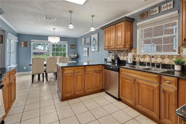 kitchen featuring kitchen peninsula, ornamental molding, sink, decorative light fixtures, and dishwasher