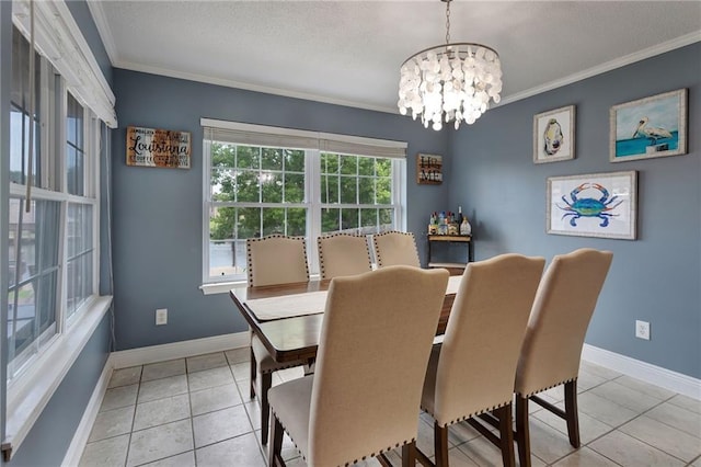 dining area with light tile patterned floors, ornamental molding, and a notable chandelier