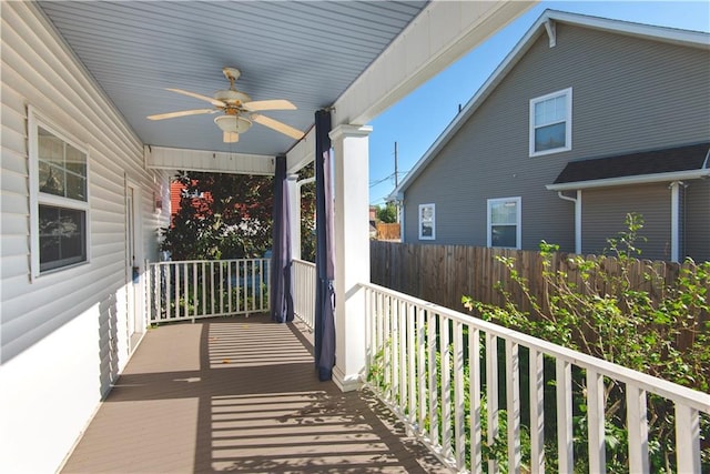 balcony with ceiling fan and covered porch