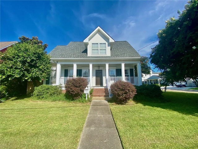 view of front of house with covered porch and a front yard