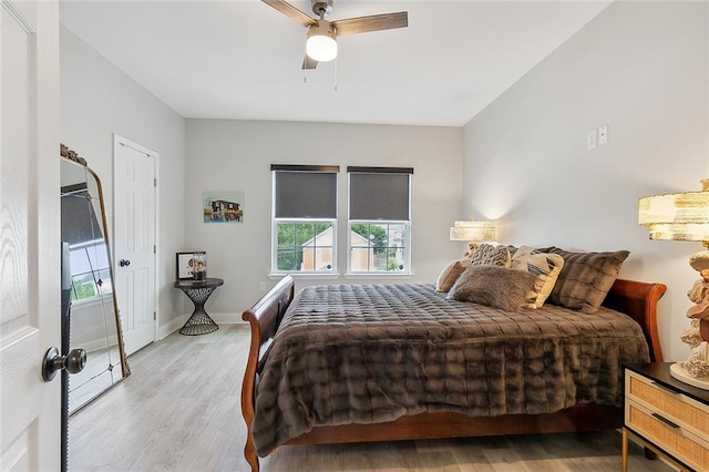 bedroom featuring light hardwood / wood-style flooring and ceiling fan