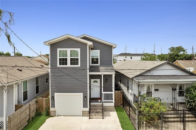 view of front of home featuring a garage and a porch