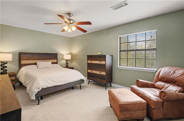 bedroom featuring ceiling fan and light colored carpet