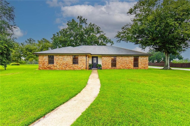 single story home with a front yard