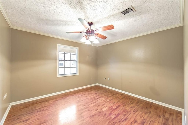 unfurnished room with crown molding, a textured ceiling, hardwood / wood-style flooring, and ceiling fan