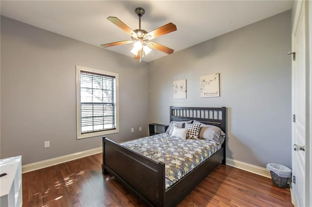 bedroom featuring dark hardwood / wood-style floors and ceiling fan