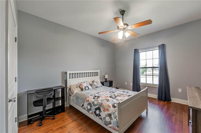 bedroom featuring ceiling fan and dark hardwood / wood-style floors