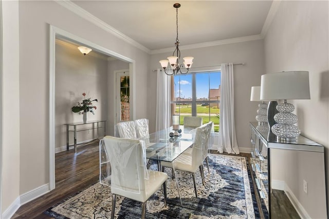 dining area featuring a notable chandelier, dark wood-type flooring, and crown molding