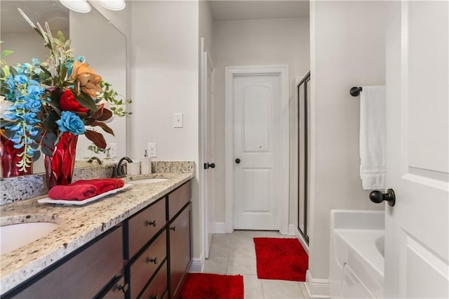 bathroom featuring vanity, separate shower and tub, and tile patterned floors