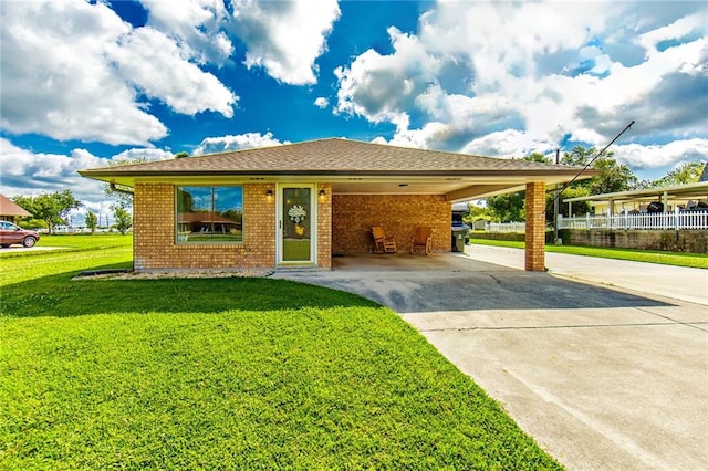 1353 Doctor Beatrous Rd, Theriot, LA 70397 - view of front of property with a front lawn and a carport