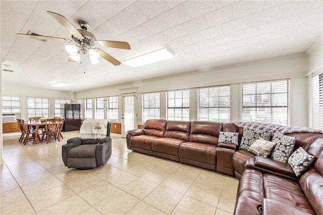 1353 Doctor Beatrous Rd, Theriot, LA 70397 - living room featuring a wealth of natural light, light tile patterned flooring, cooling unit, and ceiling fan