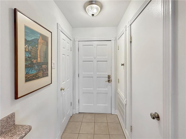 doorway to outside featuring light tile patterned floors