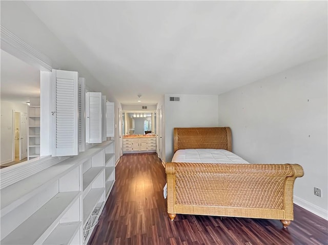 bedroom with dark hardwood / wood-style flooring