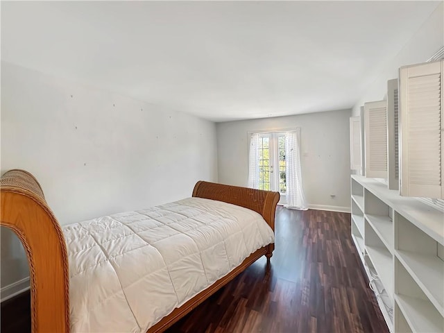 bedroom with french doors and dark hardwood / wood-style flooring