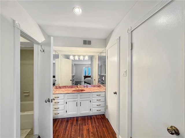 bathroom with wood-type flooring and vanity