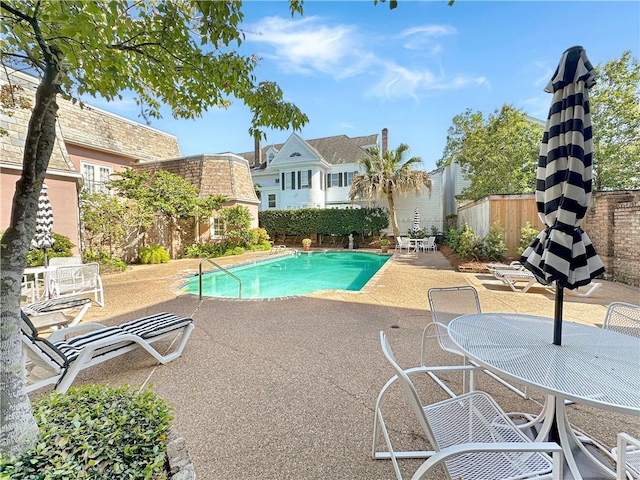 view of pool featuring a patio