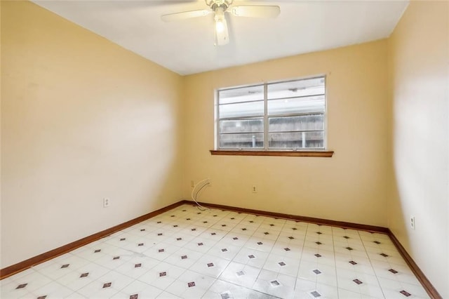 spare room with ceiling fan