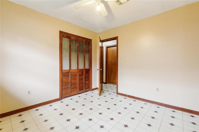 unfurnished bedroom featuring a closet and ceiling fan