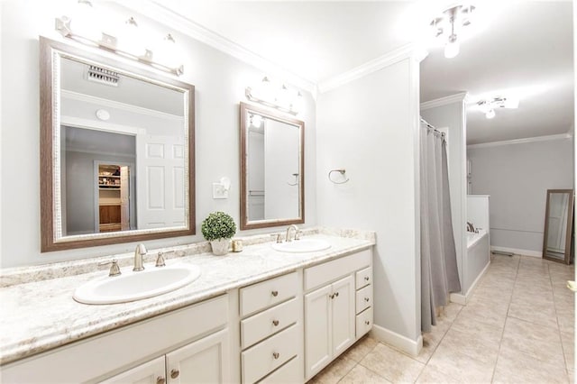 bathroom featuring vanity, ornamental molding, and tile patterned floors