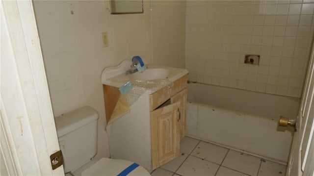 bathroom with vanity, toilet, and tile patterned flooring