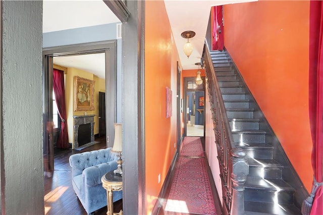 stairway with hardwood / wood-style flooring