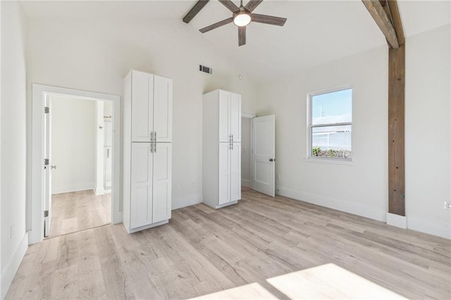 unfurnished bedroom with light hardwood / wood-style floors, beamed ceiling, and ceiling fan