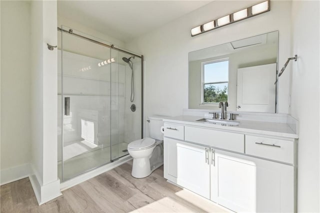 5017 N Miro St, New Orleans, LA 70117 - full bath with wood finished floors, toilet, vanity, and a stall shower