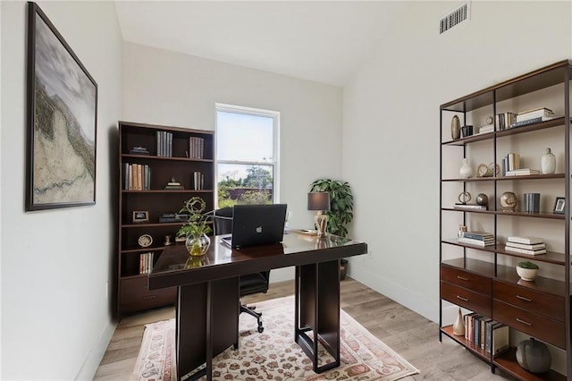 office space with light wood-type flooring