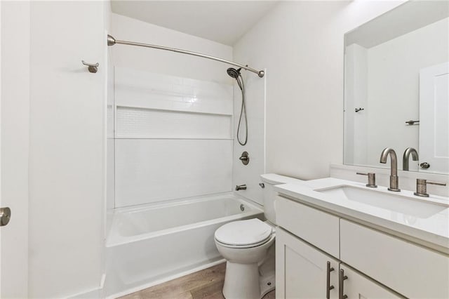 5017 N Miro St, New Orleans, LA 70117 - bathroom featuring bathing tub / shower combination, wood finished floors, vanity, and toilet