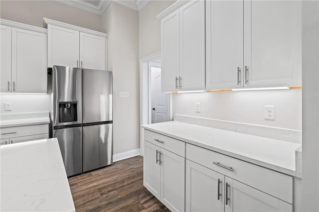 kitchen with crown molding, dark hardwood / wood-style flooring, stainless steel fridge with ice dispenser, and white cabinets