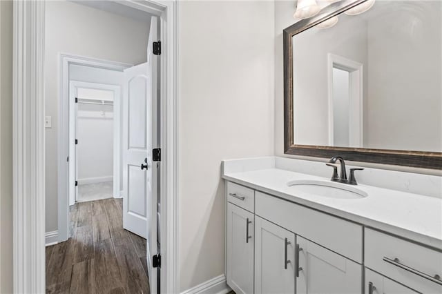 bathroom with vanity and hardwood / wood-style flooring