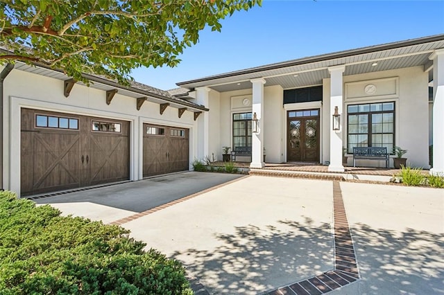 view of front of house featuring a porch and a garage