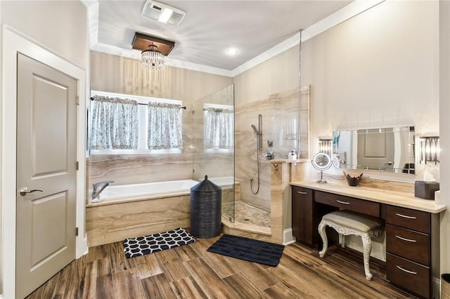 bathroom featuring vanity, independent shower and bath, and hardwood / wood-style floors