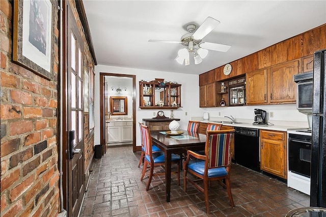 kitchen with ceiling fan, black appliances, and sink