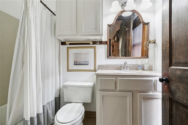 bathroom with toilet and vanity