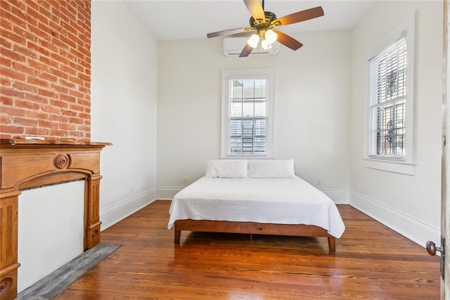 bedroom featuring hardwood / wood-style flooring and ceiling fan