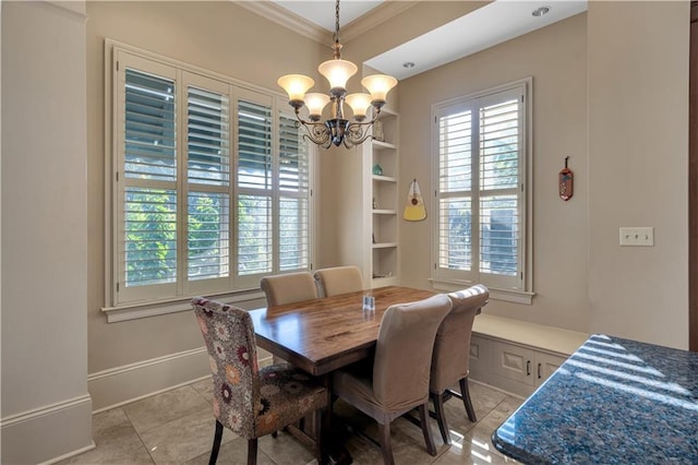 tiled dining room featuring ornamental molding and a notable chandelier